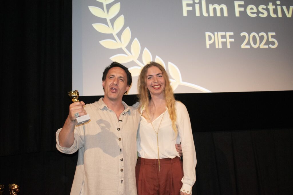 Artur Smolyaninov receiving the Best Actor award from festival director Diana Ringo
